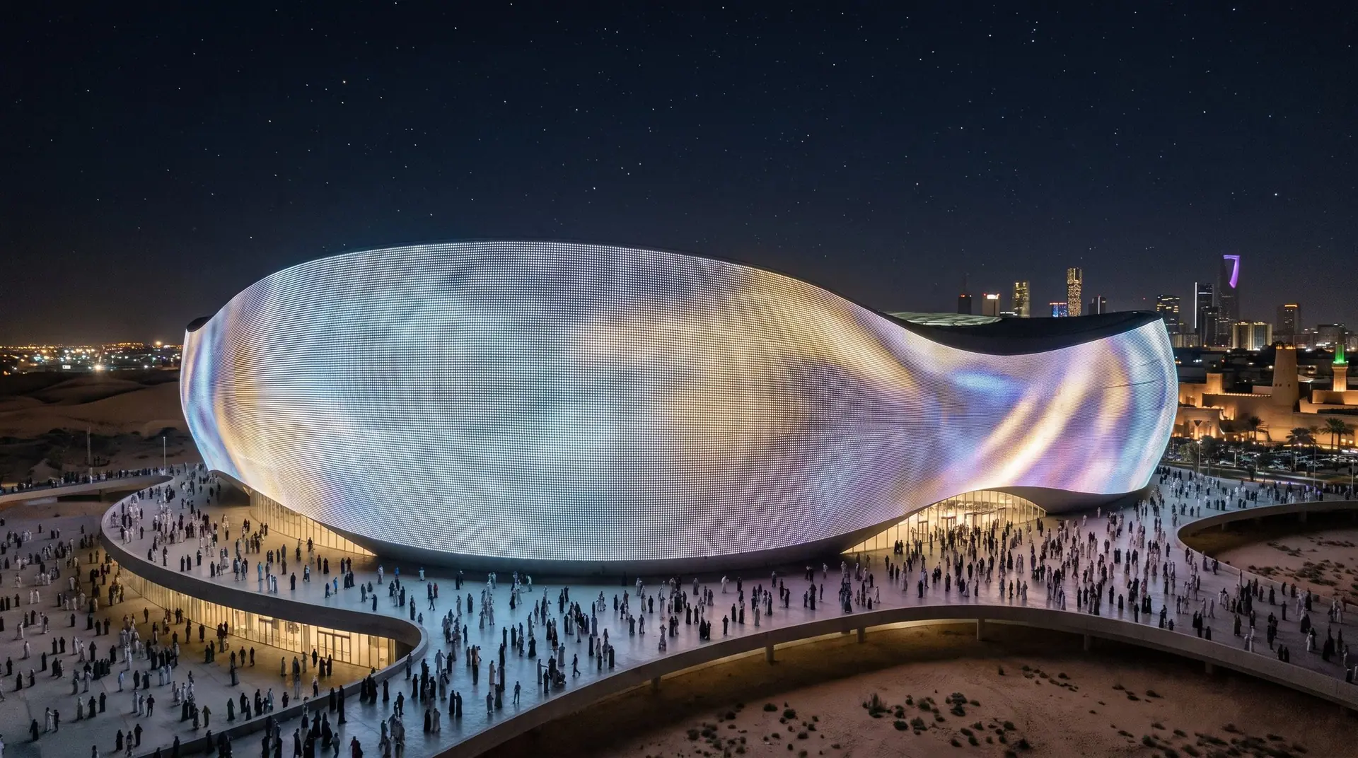 Arena facade wrapped in LED mesh at night