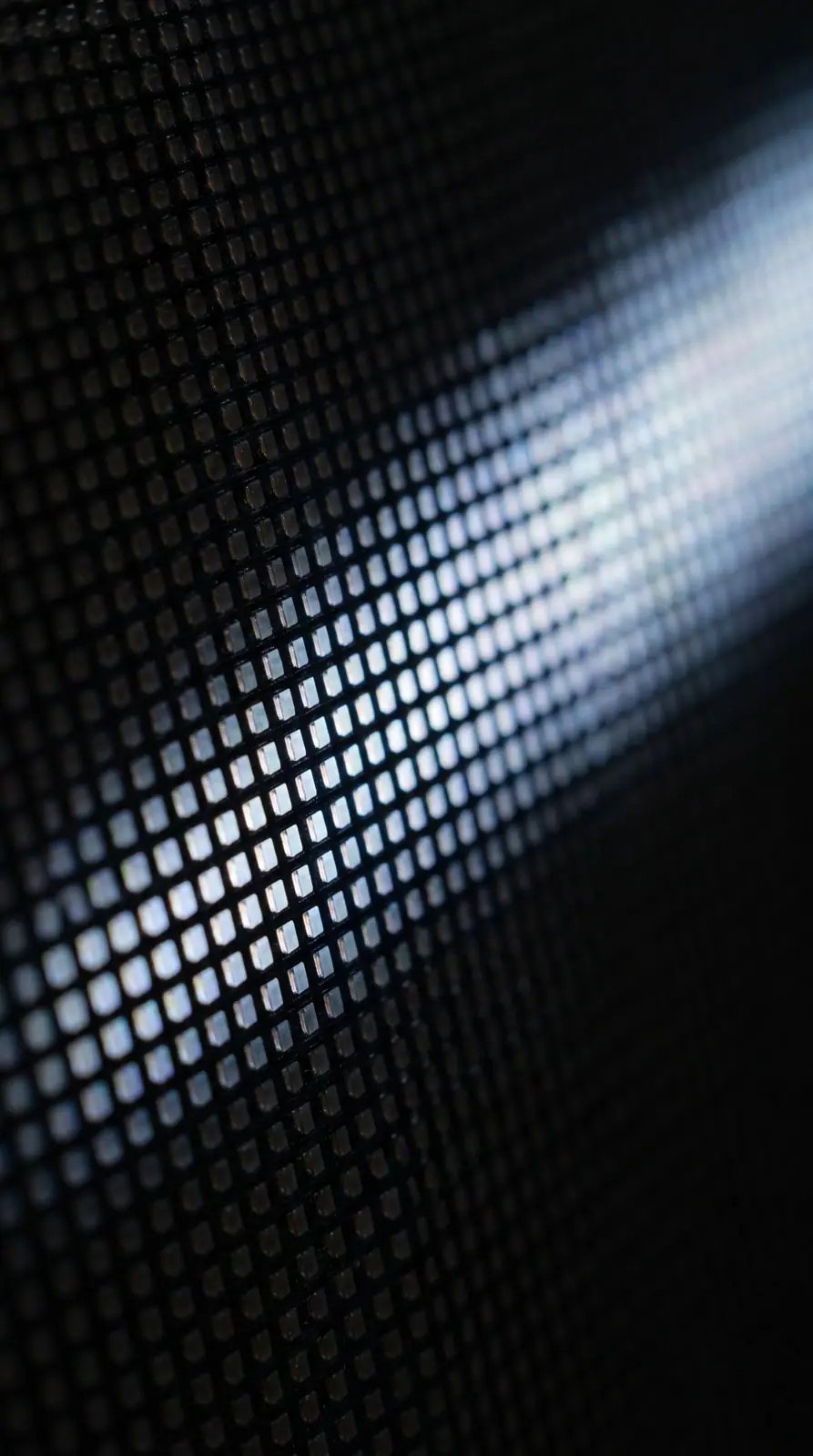 Macro view of a fine-pitch LED module, a band of cells lit in white